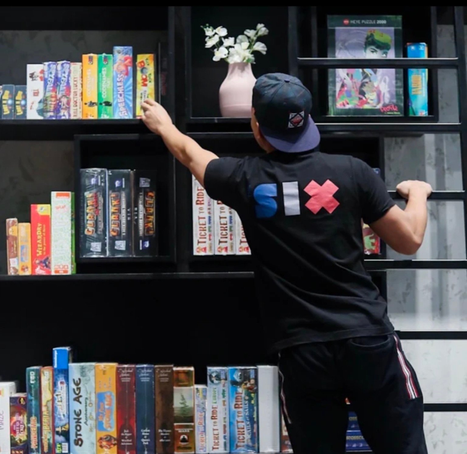 The Six team member choosing a board game