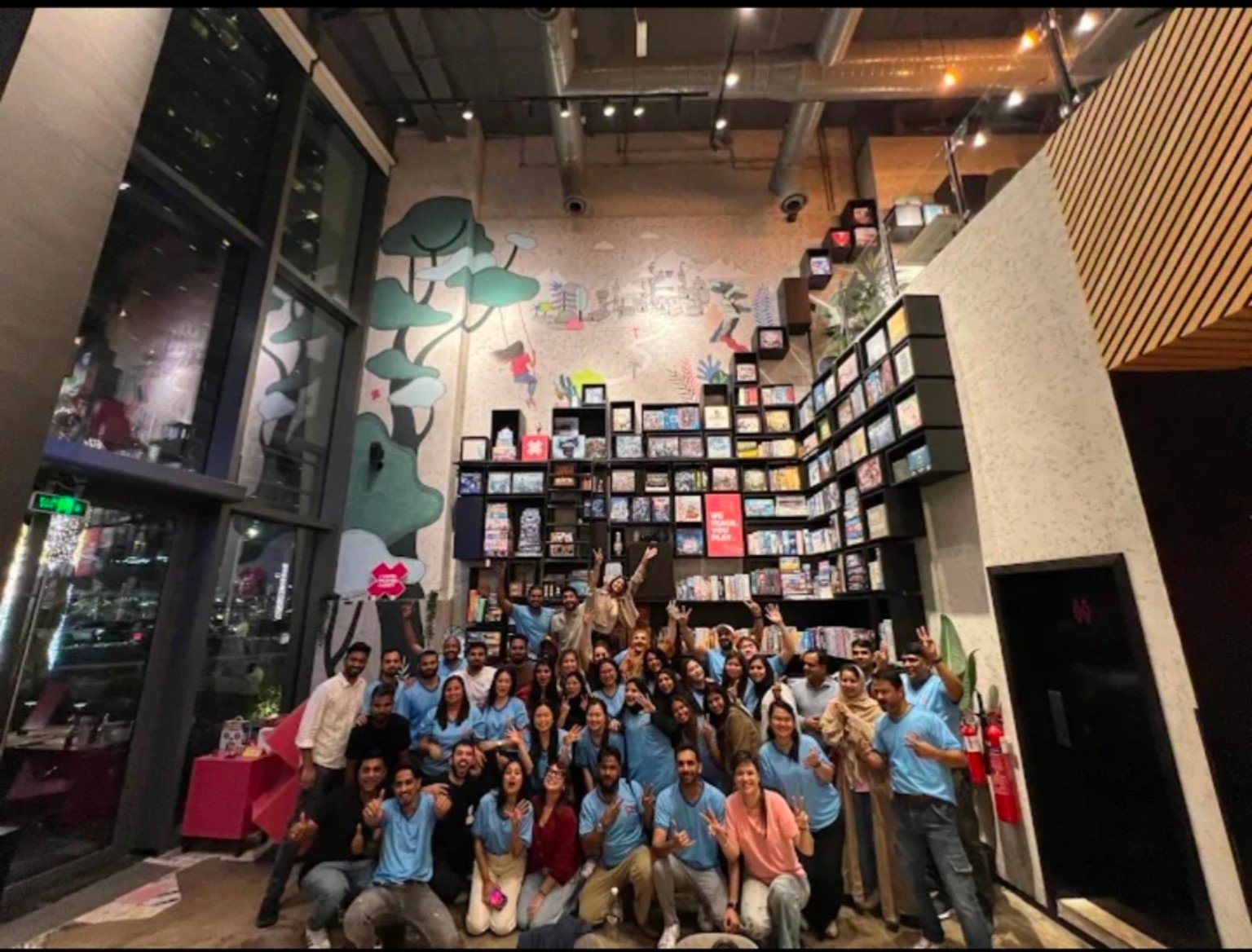 A group gathered at The Six café
